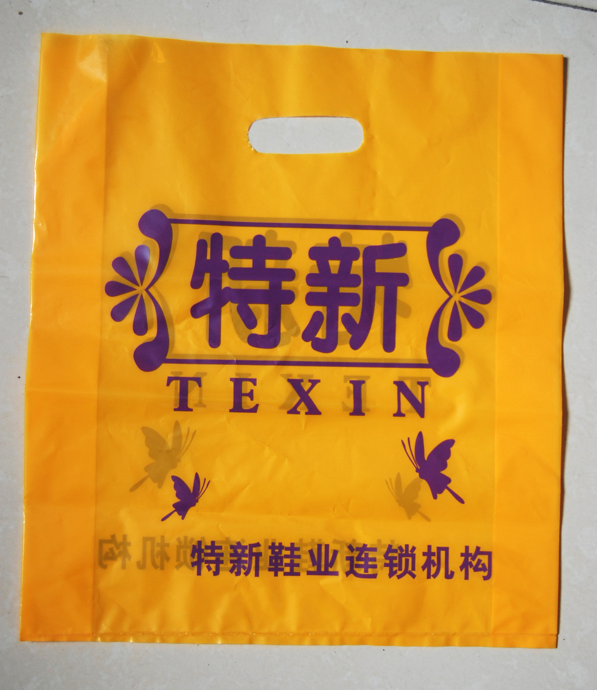 鞋服店四指手提袋